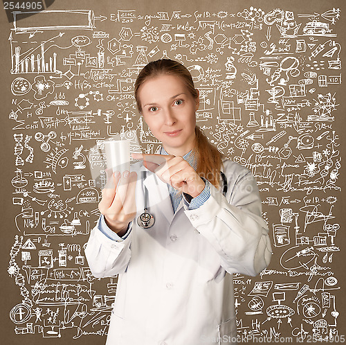 Image of Doctor woman with cup for analysis