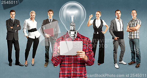 Image of Business Team With Lamp Head