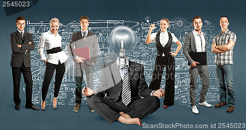 Image of Business Team With Lamp Head