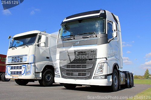 Image of Two White Volvo FH Trucks