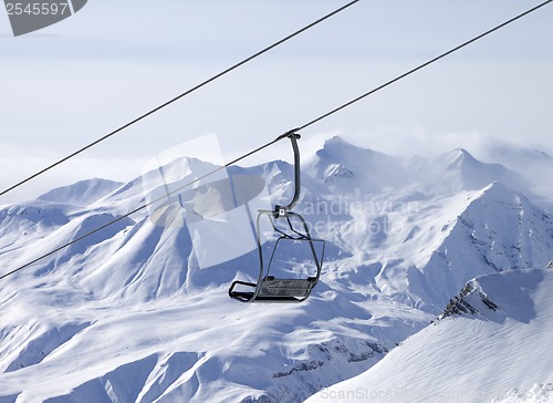 Image of Chair lifts and off-piste slope in fog