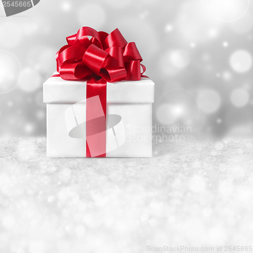 Image of gift box with red ribbon bow