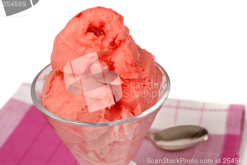 Image of Glass of cherry sherbert on a red and white napkin