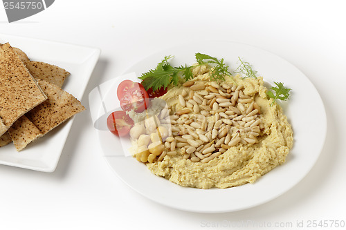 Image of Lebanese hummus and pine nuts