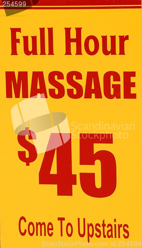 Image of A yellow and red sign advertising hour long massages