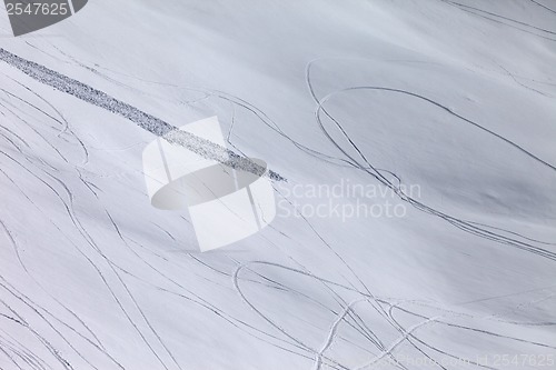 Image of Off piste slope with traces of skis, snowboarding and avalanche