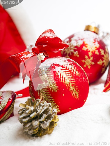 Image of Christmas ball with red bow and ribbon