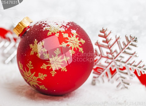 Image of Christmas ball with red bow and ribbon