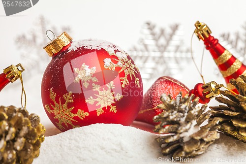 Image of Christmas ball with red bow and ribbon