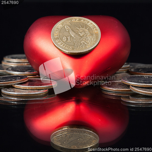 Image of Red heart and U.S. dollar coins