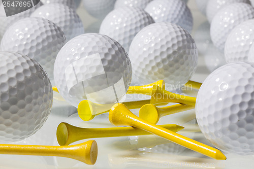 Image of Many golf balls on a glass table