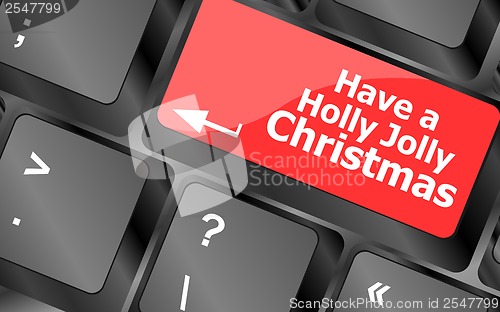 Image of Computer keyboard key with have a holly jolly christmas words