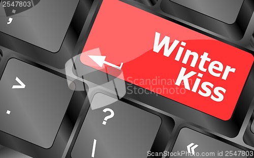 Image of winter kiss on computer keyboard key button