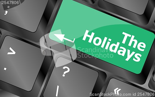 Image of the holidays button on modern internet computer keyboard key