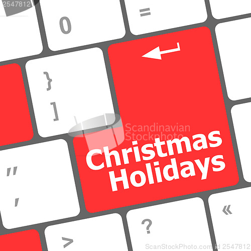 Image of Computer keyboard key with christmas holidays words