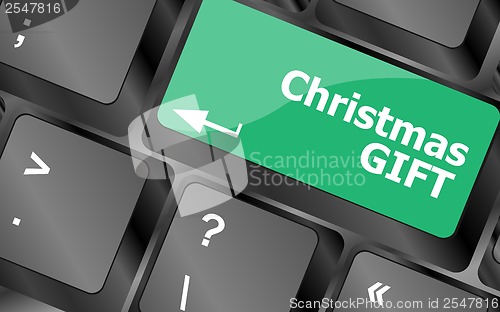 Image of Computer keyboard key with christmas gift words