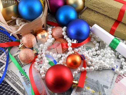 Image of Christmas gift box, christmas balls, money and diamonds