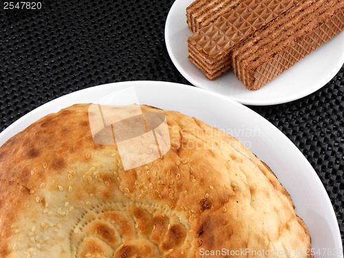 Image of cake and waffle on white plate