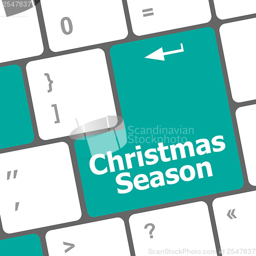 Image of Computer keyboard key with christmas season words
