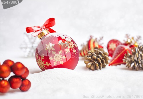 Image of Christmas ball with red bow and ribbon