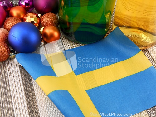 Image of Sweden flag with christmas decoration, new year card