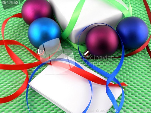 Image of Christmas balls, white gift box and white invitation card
