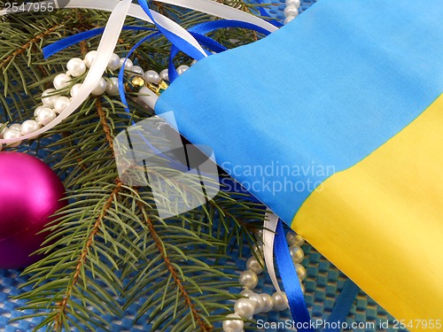 Image of Ukraine flag with christmas decoration, new year card