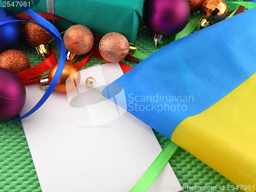 Image of Ukraine flag with christmas decoration, new year card