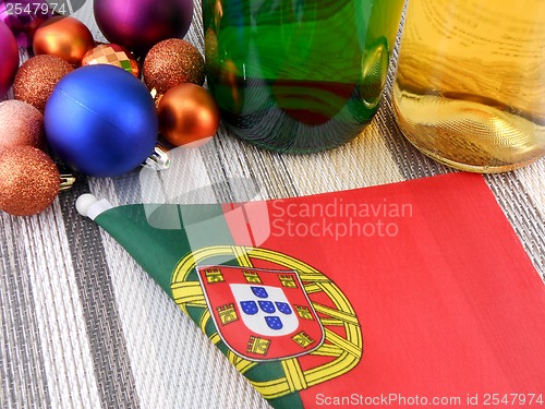 Image of portugal flag with christmas decoration, new year card