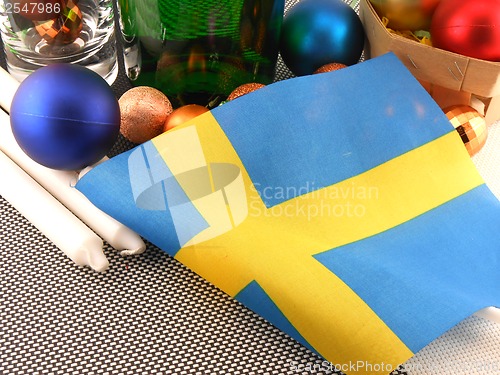 Image of Sweden flag with christmas decoration, new year card