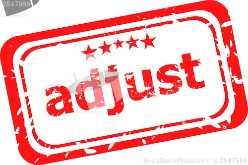 Image of red rubber stamp with adjust word