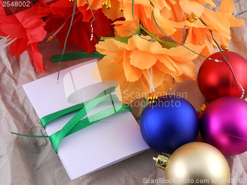 Image of New year and christmas celebration, balls, flowers and invitation card