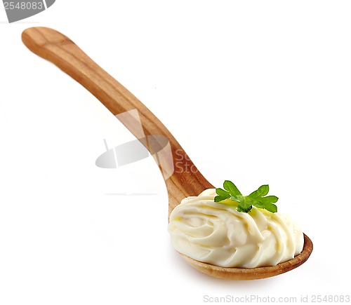 Image of wooden spoon with cream cheese