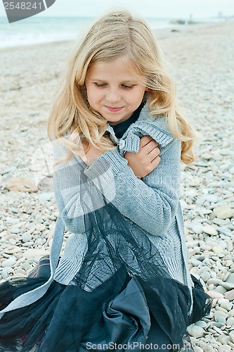 Image of pretty girl at the autumn beach 