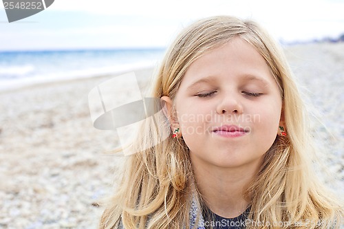 Image of cute young girl at the beach