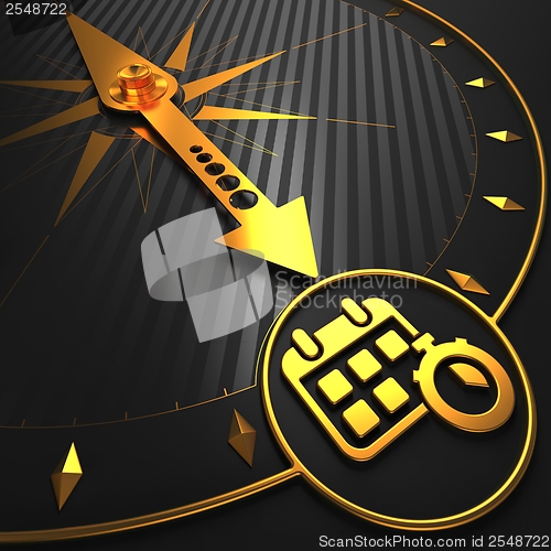 Image of Golden Calendar with Stopwatch on Black Compass.