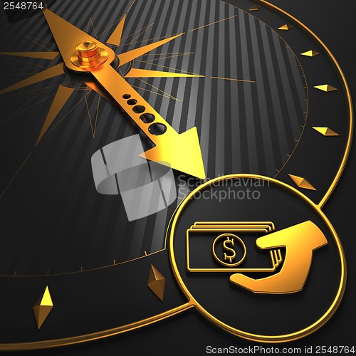 Image of Golden Icon of Money in the Hand on Black Compass.