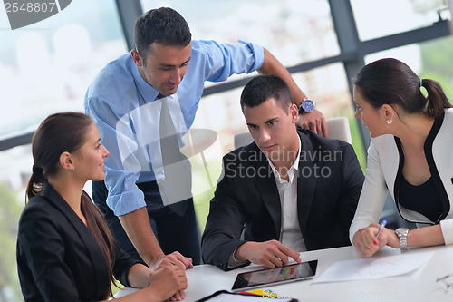 Image of business people group in a meeting at office