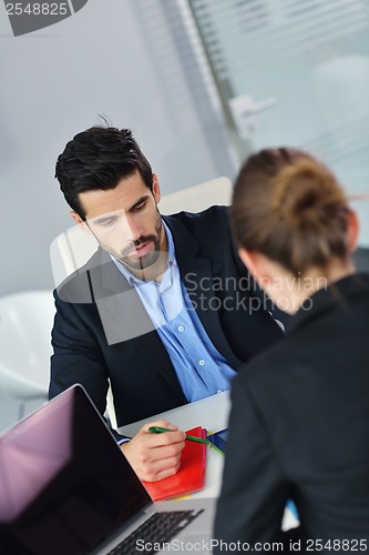 Image of business people group in a meeting at office