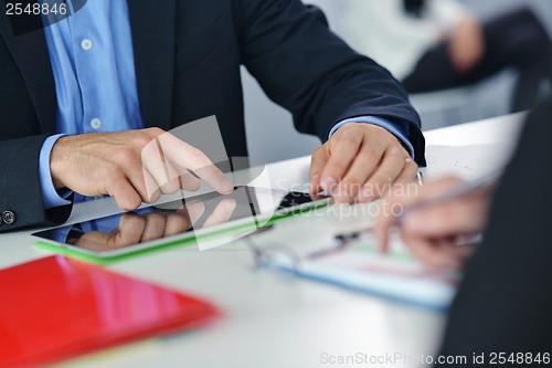 Image of business people group in a meeting at office