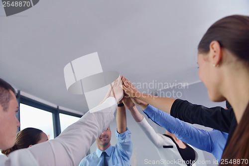 Image of business people group joining hands