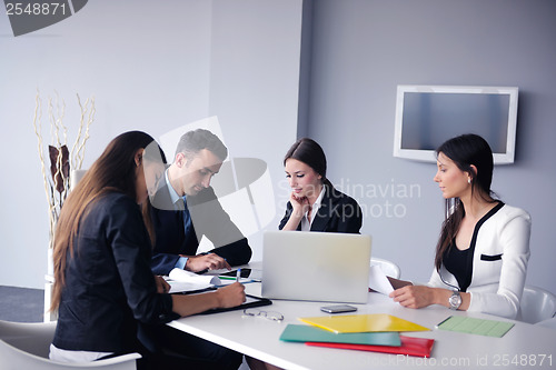 Image of business people group in a meeting at office