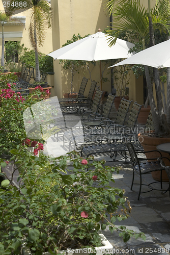 Image of lounge chairs patio with flowers