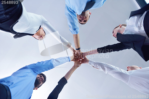 Image of business people group joining hands