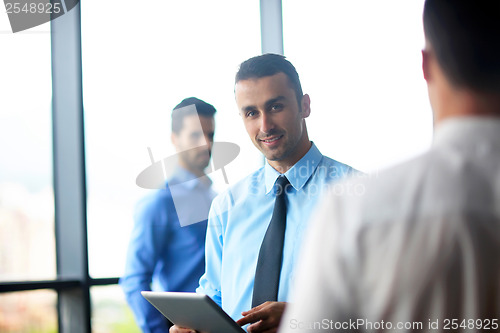 Image of business man using tablet compuer at office