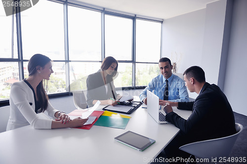 Image of business people group in a meeting at office