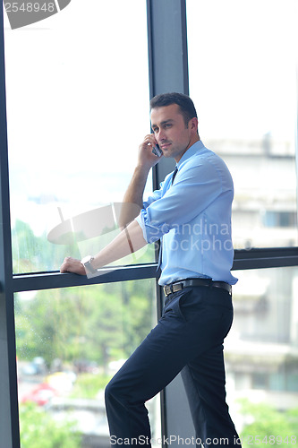 Image of business man talking by cellphone