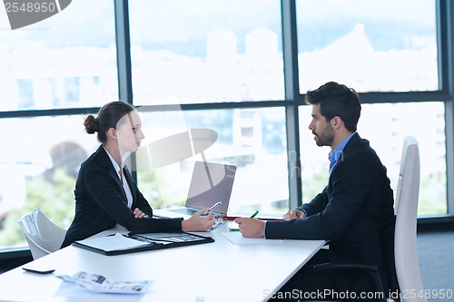 Image of business people group in a meeting at office