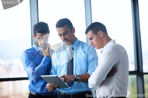 Image of business man using tablet compuer at office