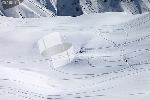 Image of View on snowy off piste slope with trace from ski and snowboards